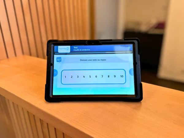 Tablette de satisfaction NPS mobile chez Acis